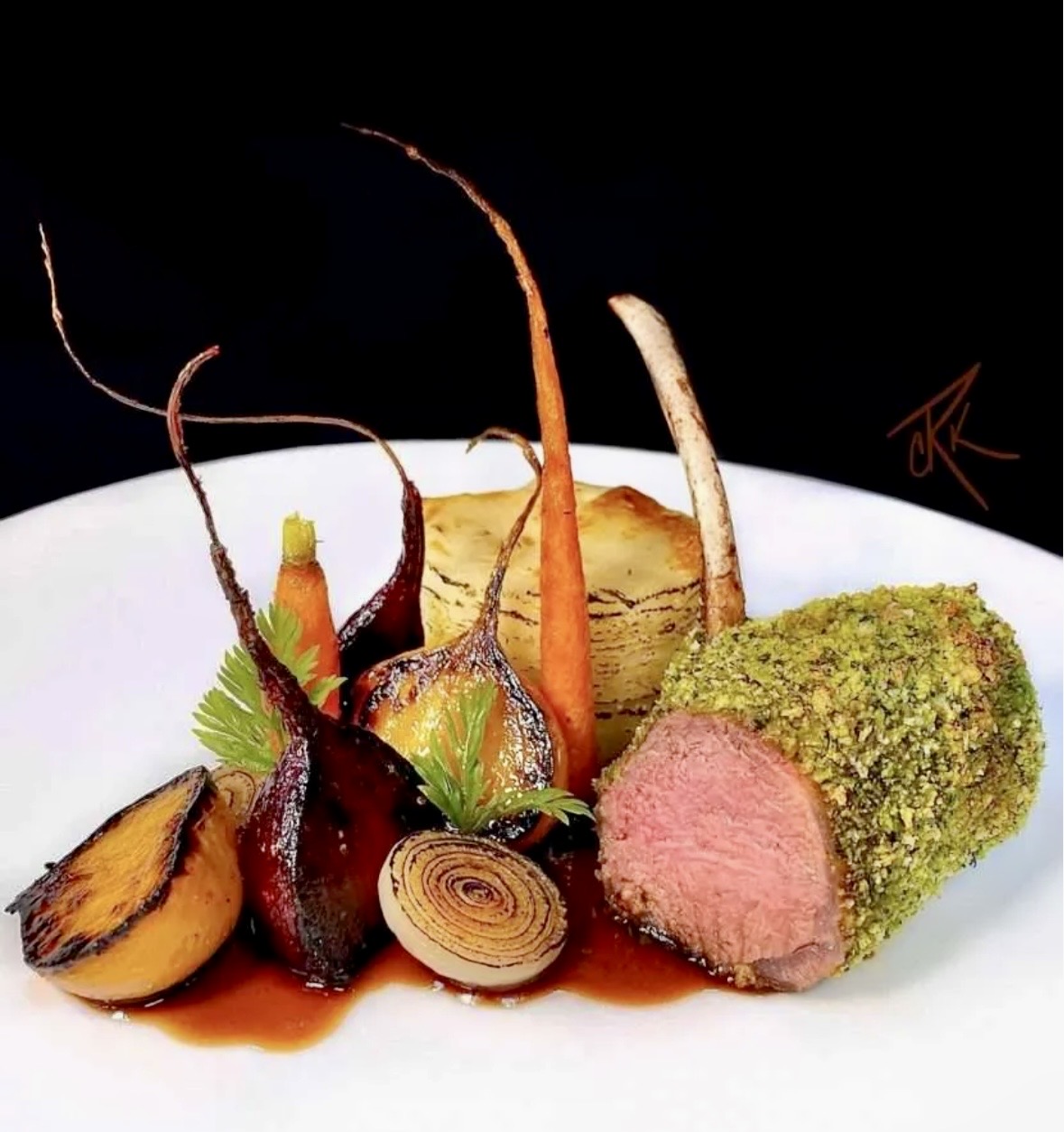 Herb-crusted rack of lamb with roasted vegetables