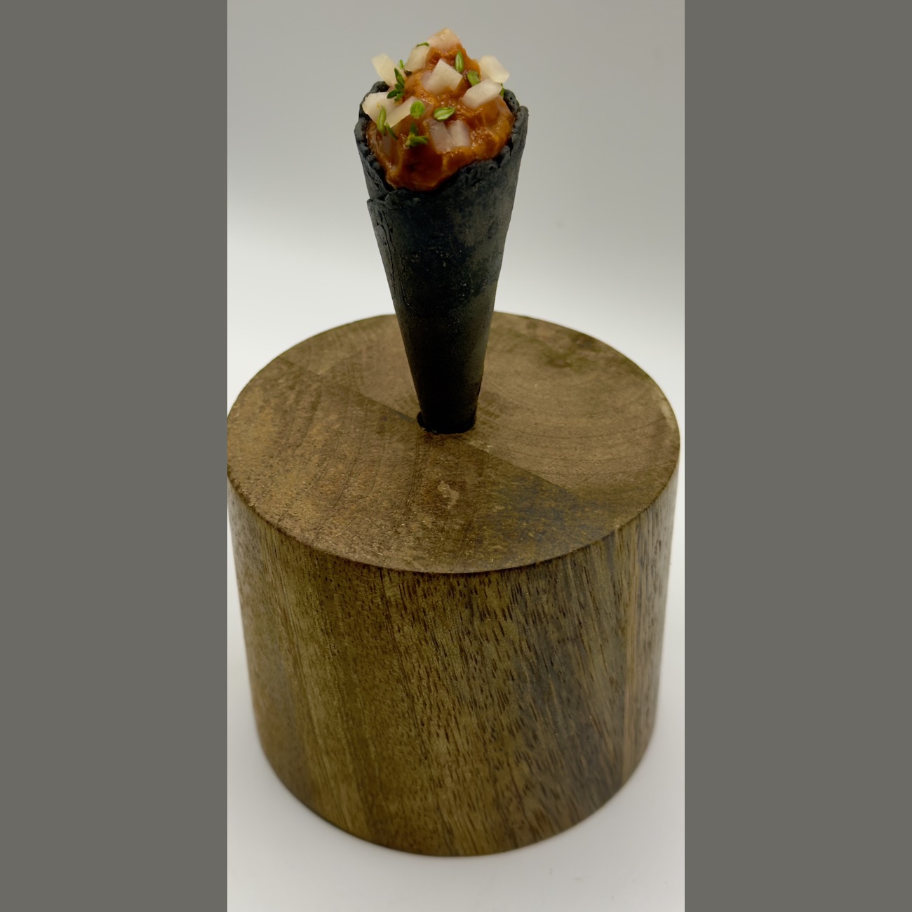 Nori cornet on wooden pedestal